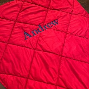 Pottery Barn Kids (4-8) red sleeping bag with ANDREW embroidered in blue.